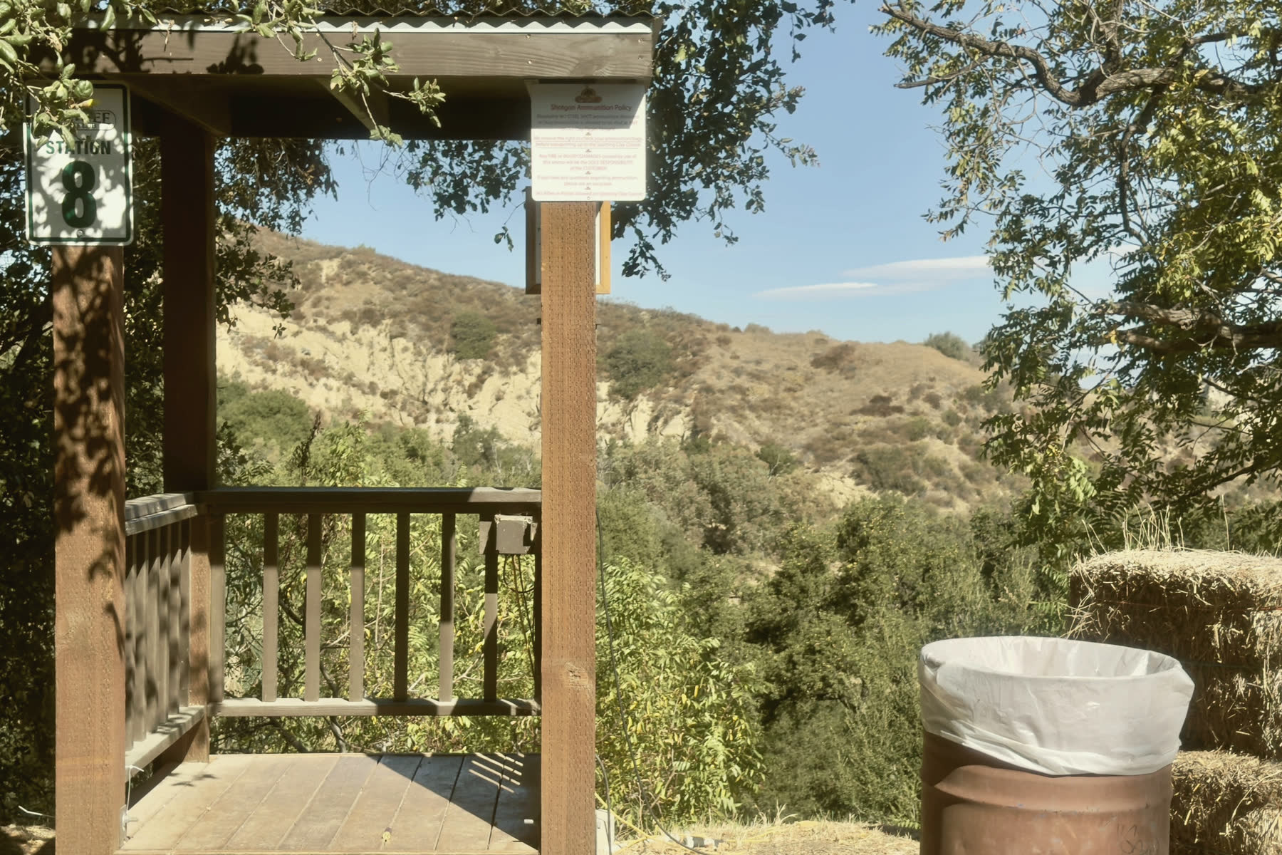 The stand at station 8 under an oak, the hills beyond.