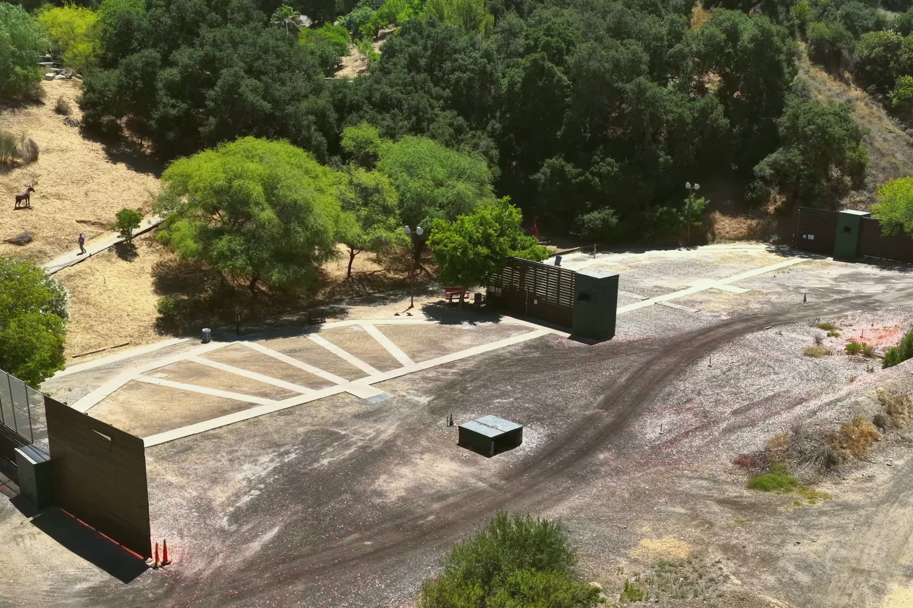 The skeet field from the air, its stations in a half circle between the two houses.